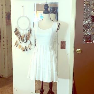 Beautiful white fit and flare dress with open back